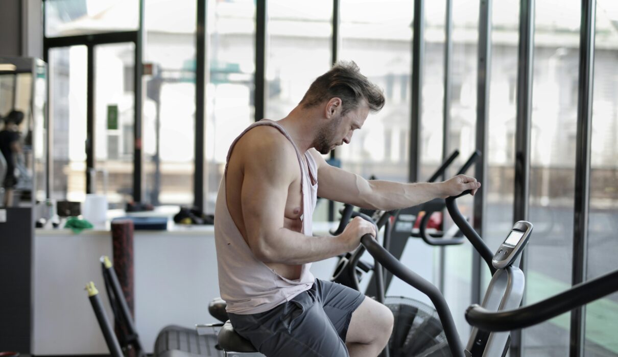 Beginner thinking about how many days a week to train while sitting in gym after workout