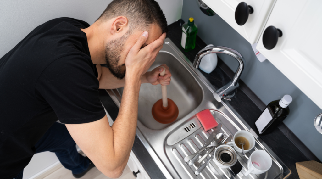 Kitchen sink with a few unwashed plates symbolizing mental overwhelm in everyday life