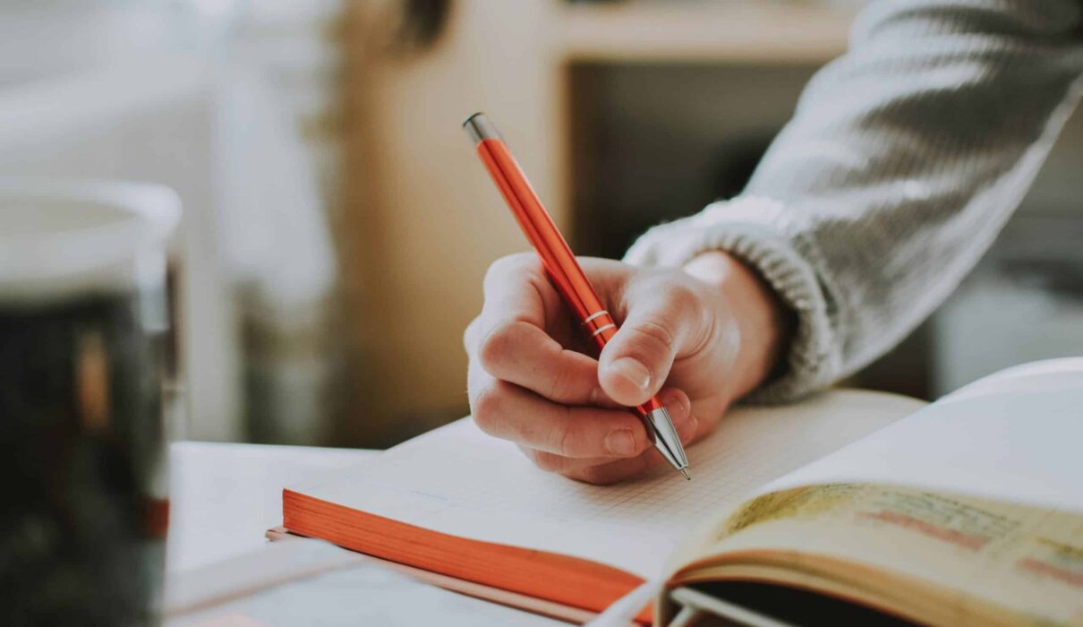 Journaling for mental health with notebook and pen in a calm setting