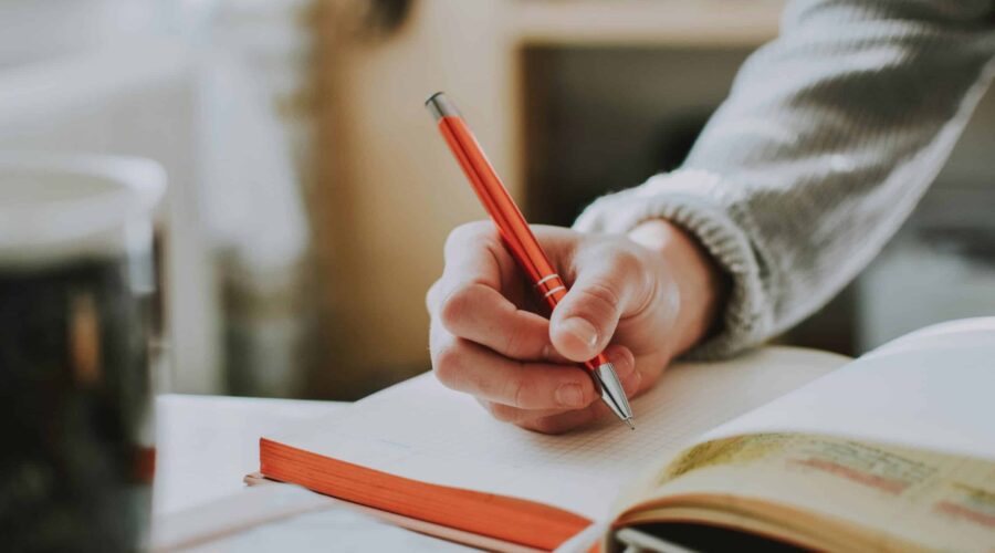 Journaling for mental health with notebook and pen in a calm setting