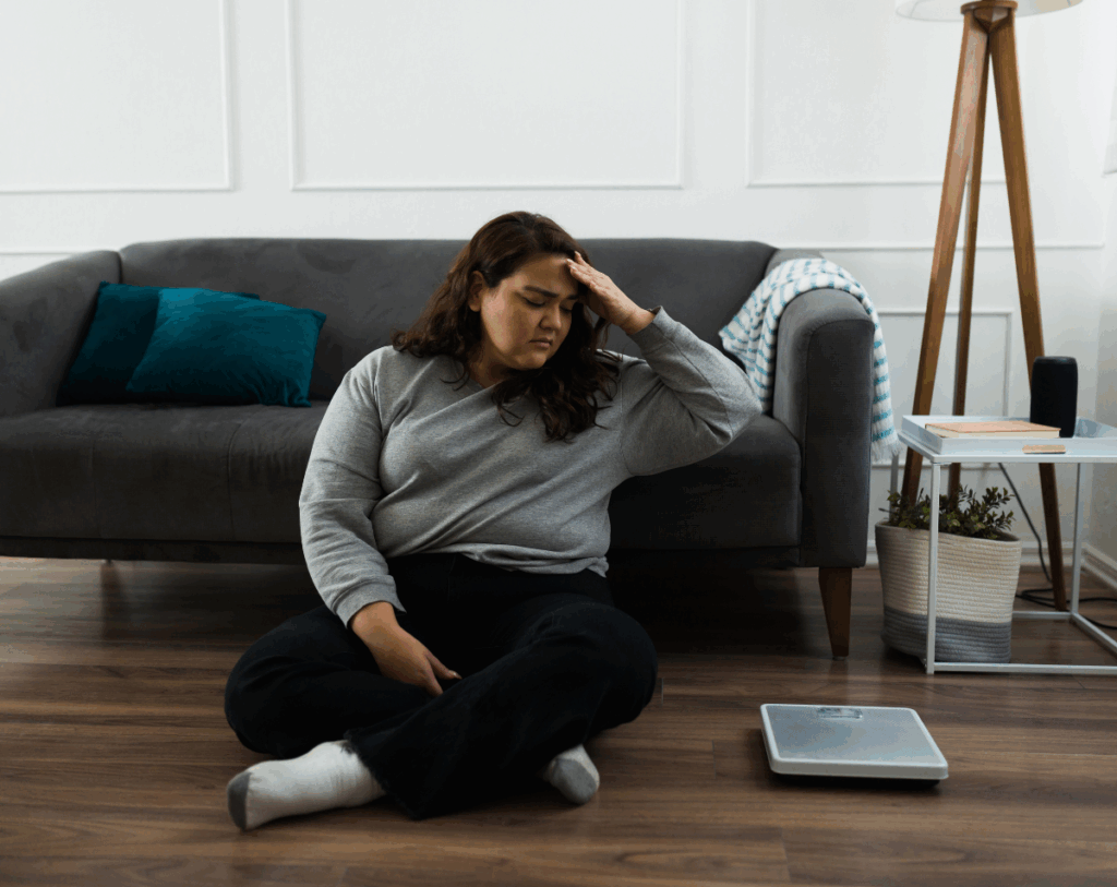 How Stress and Sleep Affect Weight Loss Tired stressed person with poor sleep affecting weight loss and hormones