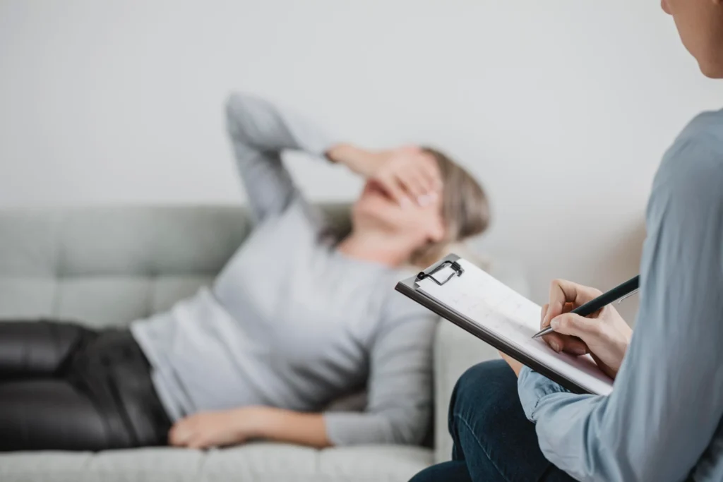person calmly sitting and reflecting showing awareness of anxiety rather than panic