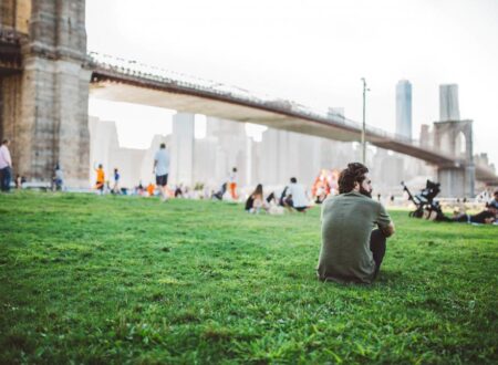 Person experiencing social anxiety feeling isolated in a group setting
