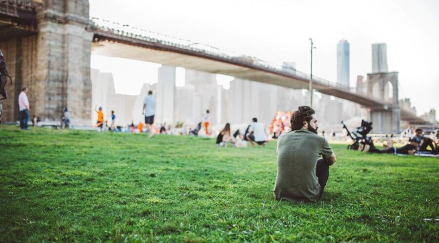 Person experiencing social anxiety feeling isolated in a group setting